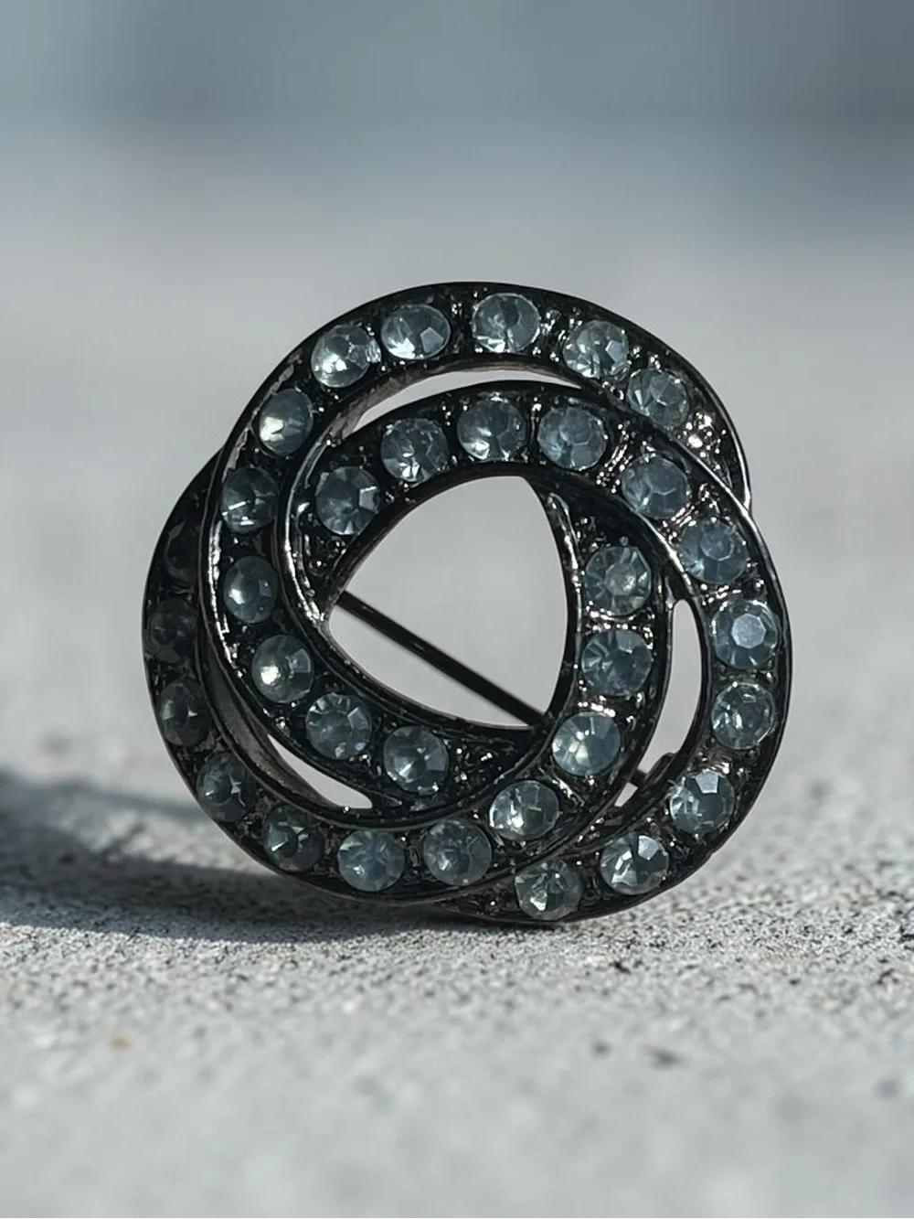 Luminous Ice Blue Crystal Gunmetal Knot Brooch Pin